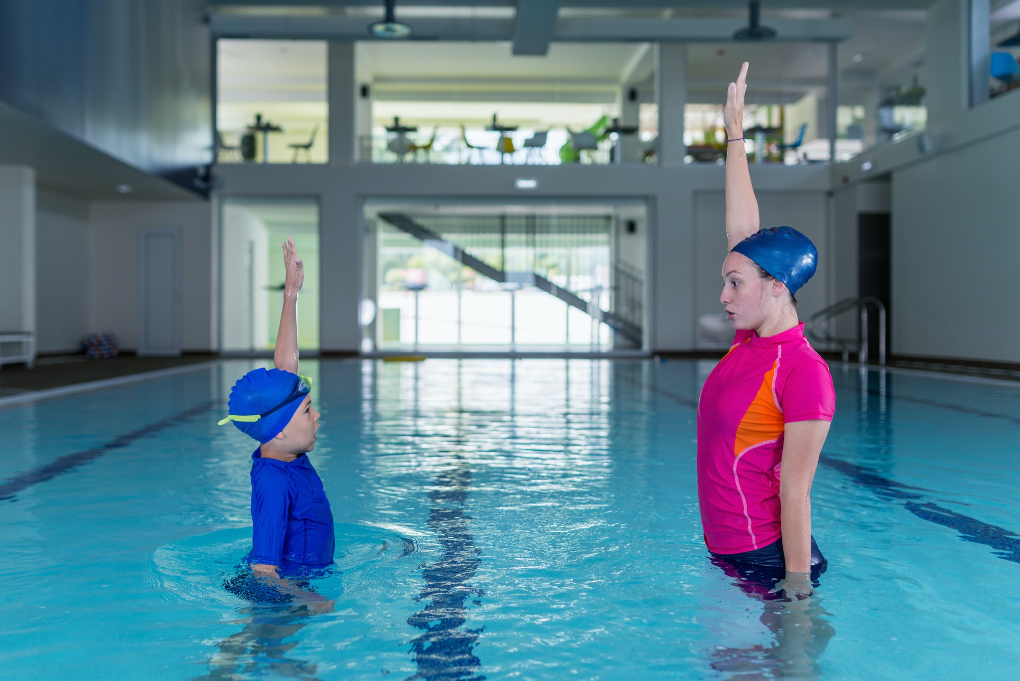 swimming-lesson-cute-little-boy-learning-to-swim-with-swimming-1.jpg